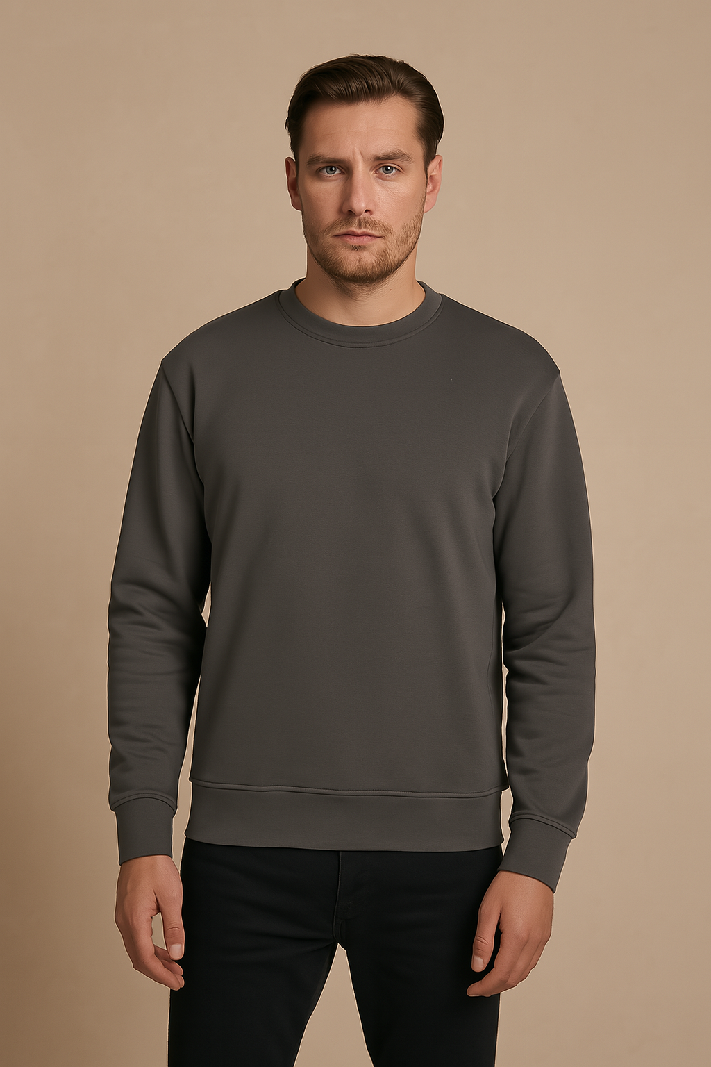 Man wearing a gray sweatshirt against a beige background