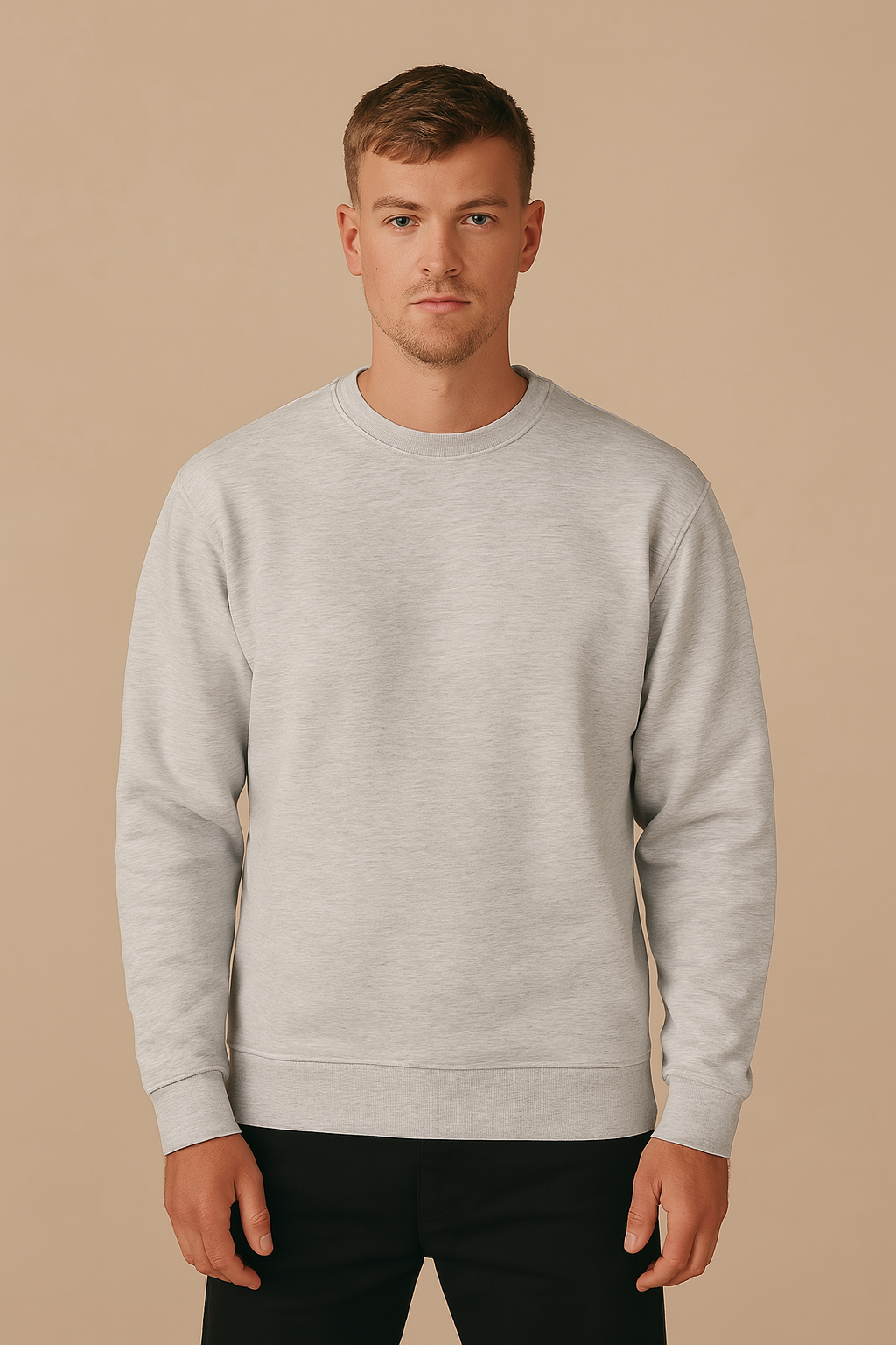 Man wearing a gray sweatshirt against a beige background