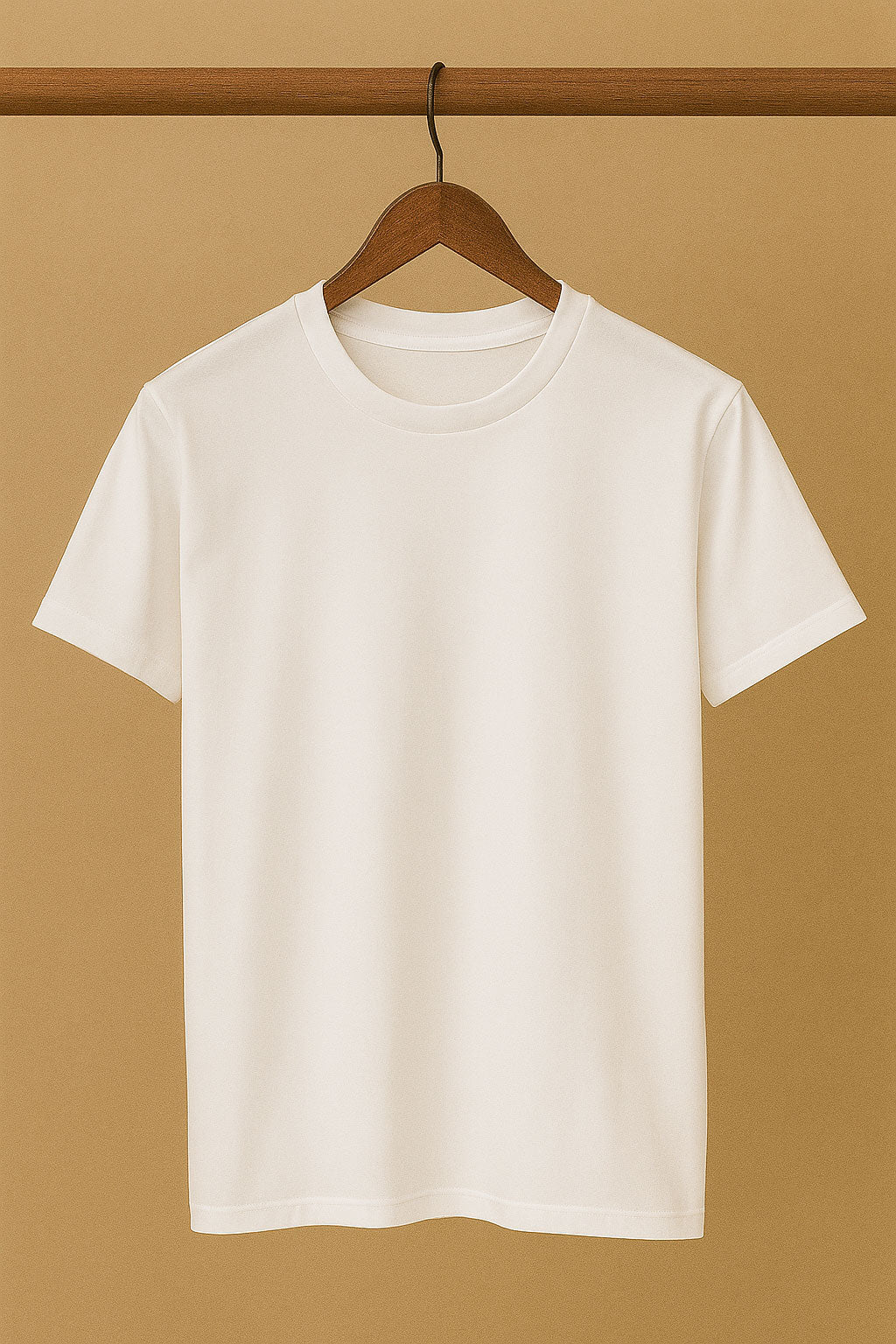 White t-shirt on a wooden hanger against a beige background